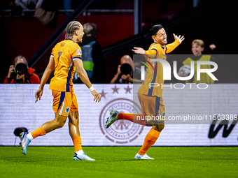 Netherlands midfielder Tijani Reijnders scores the 1-0 and celebrates the goal during the match between the Netherlands and Germany at the J...