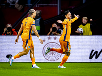 Netherlands midfielder Tijani Reijnders scores the 1-0 and celebrates the goal during the match between the Netherlands and Germany at the J...