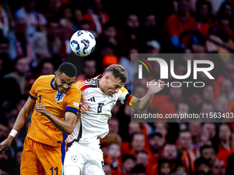 Netherlands forward Cody Gakpo and Germany midfielder Joshua Kimmich during the match between the Netherlands and Germany at the Johan Cruij...