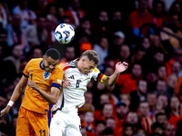 Netherlands forward Cody Gakpo and Germany midfielder Joshua Kimmich during the match between the Netherlands and Germany at the Johan Cruij...