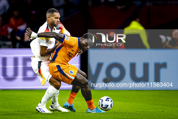 Germany defender Jonathan Tah and Netherlands forward Brian Brobbey during the match between the Netherlands and Germany at the Johan Cruijf...