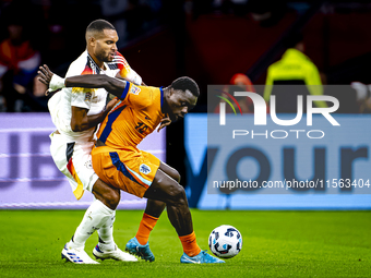 Germany defender Jonathan Tah and Netherlands forward Brian Brobbey during the match between the Netherlands and Germany at the Johan Cruijf...