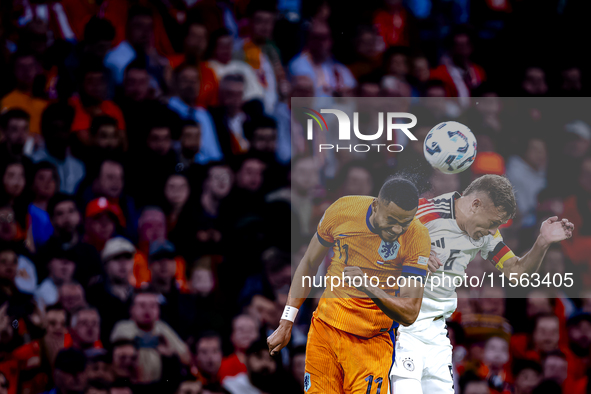 Netherlands forward Cody Gakpo and Germany midfielder Joshua Kimmich during the match between the Netherlands and Germany at the Johan Cruij...