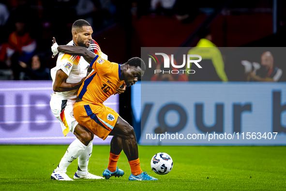 Germany defender Jonathan Tah and Netherlands forward Brian Brobbey during the match between the Netherlands and Germany at the Johan Cruijf...