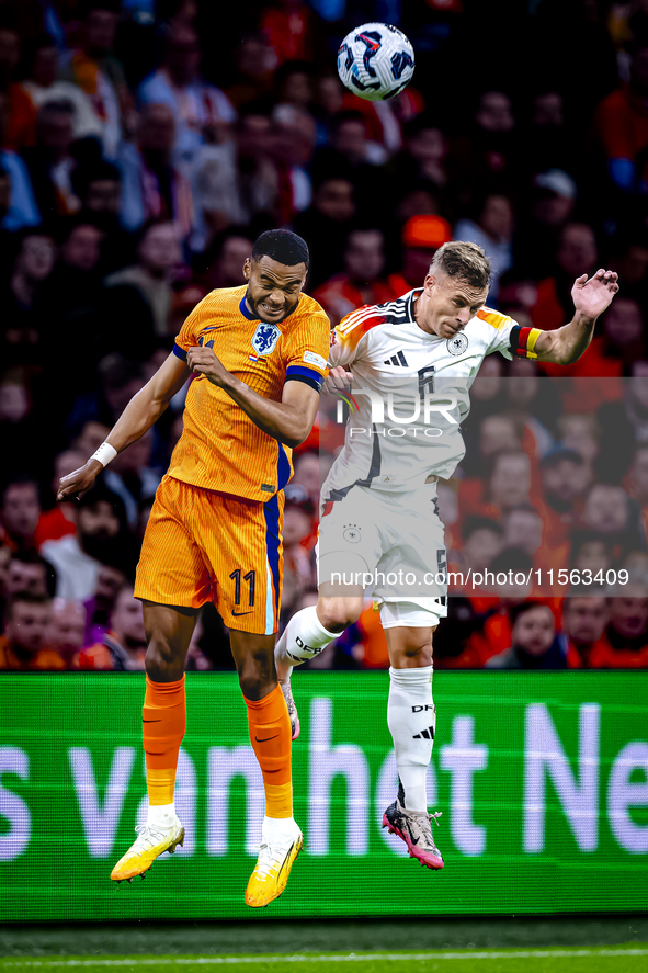 Netherlands forward Cody Gakpo and Germany midfielder Joshua Kimmich during the match between the Netherlands and Germany at the Johan Cruij...