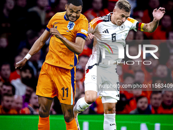 Netherlands forward Cody Gakpo and Germany midfielder Joshua Kimmich during the match between the Netherlands and Germany at the Johan Cruij...