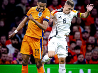 Netherlands forward Cody Gakpo and Germany midfielder Joshua Kimmich during the match between the Netherlands and Germany at the Johan Cruij...