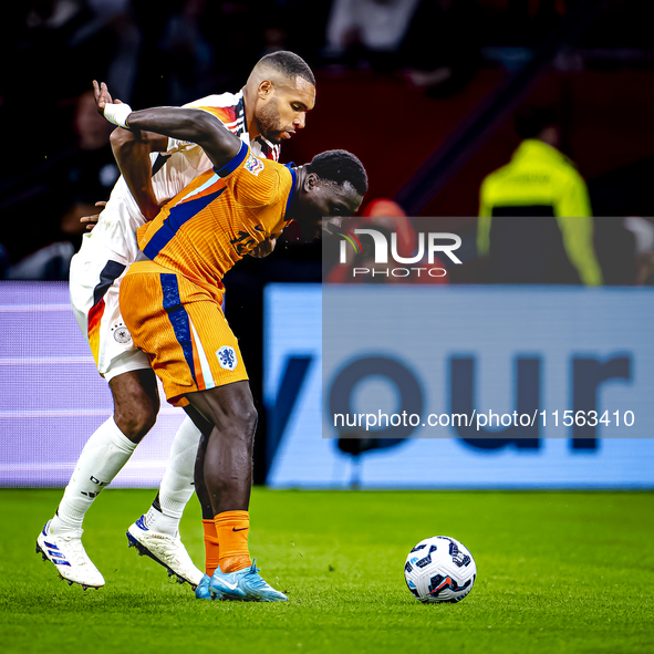 Germany defender Jonathan Tah and Netherlands forward Brian Brobbey during the match between the Netherlands and Germany at the Johan Cruijf...