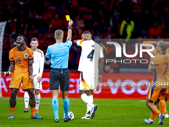 Germany defender Jonathan Tah receives a yellow card during the match between the Netherlands and Germany at the Johan Cruijff ArenA for the...