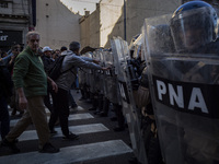 Police repress retirees outside the Argentine National Congress due to President Javier Milei's veto of the increase in pensions in Buenos A...