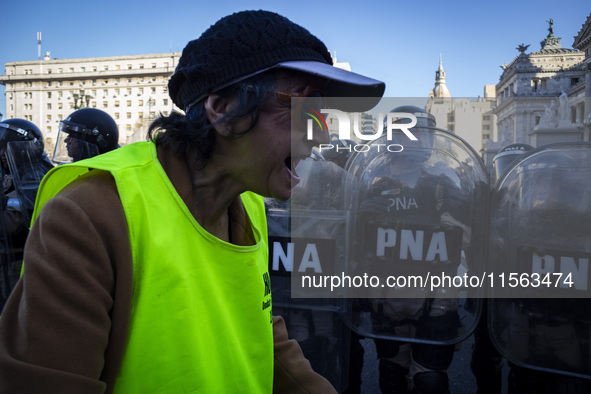 Police repress retirees outside the Argentine National Congress due to President Javier Milei's veto of the increase in pensions in Buenos A...