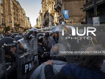 Police repress retirees outside the Argentine National Congress due to President Javier Milei's veto of the increase in pensions in Buenos A...