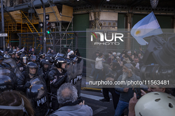 Police repress retirees outside the Argentine National Congress due to President Javier Milei's veto of the increase in pensions in Buenos A...