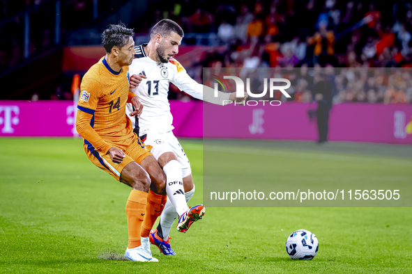 Netherlands midfielder Tijani Reijnders and Germany forward Deniz Undav during the match between the Netherlands and Germany at the Johan Cr...