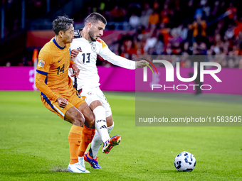 Netherlands midfielder Tijani Reijnders and Germany forward Deniz Undav during the match between the Netherlands and Germany at the Johan Cr...