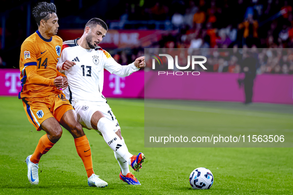 Netherlands midfielder Tijani Reijnders and Germany forward Deniz Undav during the match between the Netherlands and Germany at the Johan Cr...