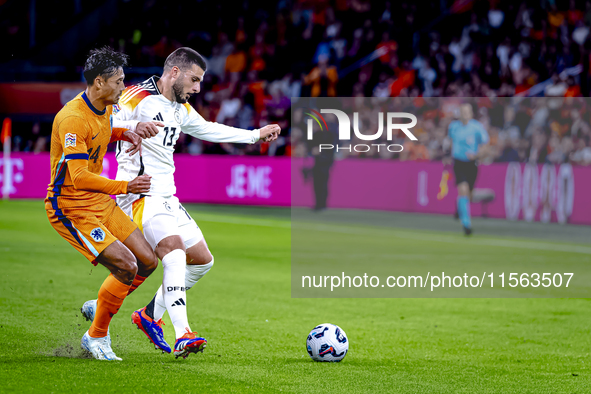 Netherlands midfielder Tijani Reijnders and Germany forward Deniz Undav during the match between the Netherlands and Germany at the Johan Cr...