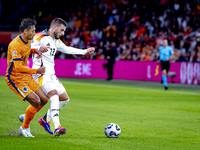 Netherlands midfielder Tijani Reijnders and Germany forward Deniz Undav during the match between the Netherlands and Germany at the Johan Cr...