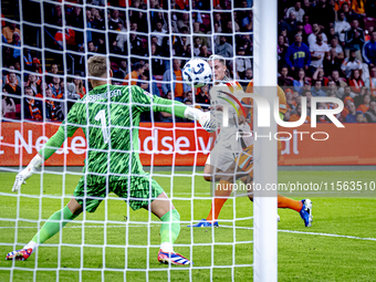 Germany midfielder Florian Wirtz and Netherlands defender Virgil van Dijk during the match between the Netherlands and Germany at the Johan...