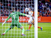 Germany midfielder Florian Wirtz and Netherlands defender Virgil van Dijk during the match between the Netherlands and Germany at the Johan...