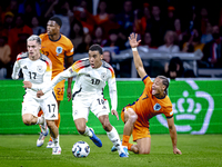 Germany midfielder Jamal Musiala and Netherlands midfielder Xavi Simons during the match between the Netherlands and Germany at the Johan Cr...