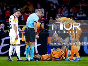 Netherlands defender Nathan Ake gets injured during the match between the Netherlands and Germany at the Johan Cruijff ArenA for the UEFA Na...