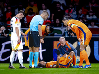 Netherlands defender Nathan Ake gets injured during the match between the Netherlands and Germany at the Johan Cruijff ArenA for the UEFA Na...