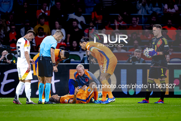 Netherlands defender Nathan Ake gets injured during the match between the Netherlands and Germany at the Johan Cruijff ArenA for the UEFA Na...