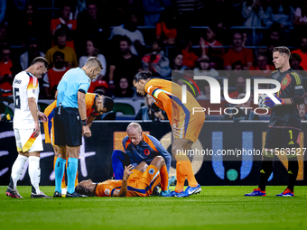 Netherlands defender Nathan Ake gets injured during the match between the Netherlands and Germany at the Johan Cruijff ArenA for the UEFA Na...