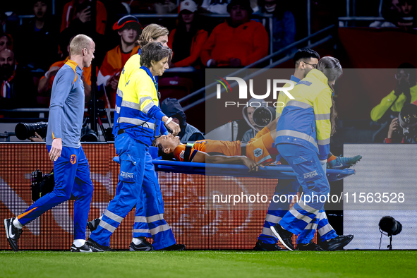 Netherlands defender Nathan Ake gets injured during the match between the Netherlands and Germany at the Johan Cruijff ArenA for the UEFA Na...