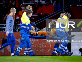 Netherlands defender Nathan Ake gets injured during the match between the Netherlands and Germany at the Johan Cruijff ArenA for the UEFA Na...