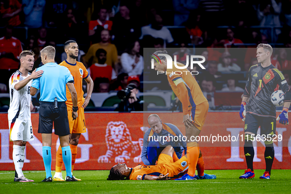 Netherlands defender Nathan Ake gets injured during the match between the Netherlands and Germany at the Johan Cruijff ArenA for the UEFA Na...