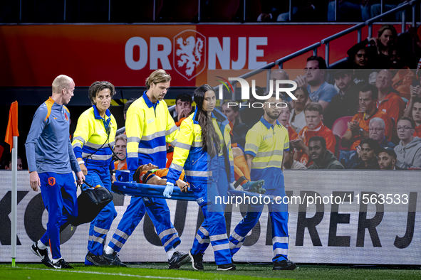 Netherlands defender Nathan Ake gets injured during the match between the Netherlands and Germany at the Johan Cruijff ArenA for the UEFA Na...