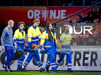 Netherlands defender Nathan Ake gets injured during the match between the Netherlands and Germany at the Johan Cruijff ArenA for the UEFA Na...