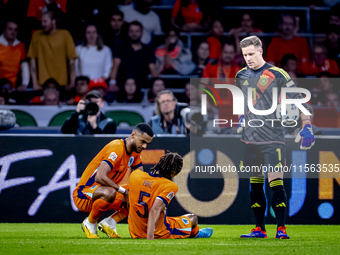 Netherlands defender Nathan Ake gets injured during the match between the Netherlands and Germany at the Johan Cruijff ArenA for the UEFA Na...