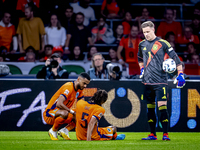 Netherlands defender Nathan Ake gets injured during the match between the Netherlands and Germany at the Johan Cruijff ArenA for the UEFA Na...