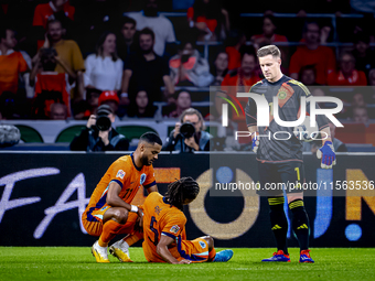 Netherlands defender Nathan Ake gets injured during the match between the Netherlands and Germany at the Johan Cruijff ArenA for the UEFA Na...