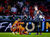 Netherlands defender Nathan Ake gets injured during the match between the Netherlands and Germany at the Johan Cruijff ArenA for the UEFA Na...