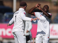 Anderson Phillip of Lancashire celebrates with Keaton Jennings after trapping Alex Lees of Durham LBW during the Vitality County Championshi...