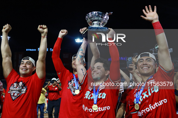 Juan Carlos Gamboa #47 of Diablos Rojos lifts the Zaachila cup after winning the 2024 Mexican Baseball League (LMB) King Series Championship...