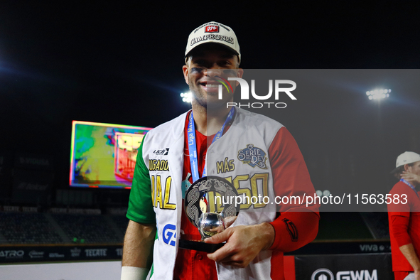 Jose Marmolejos #46 of Diablos Rojos receives the MVP prize after winning the 2024 Mexican Baseball League (LMB) King Series Championship at...