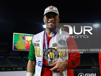 Jose Marmolejos #46 of Diablos Rojos receives the MVP prize after winning the 2024 Mexican Baseball League (LMB) King Series Championship at...