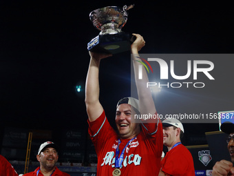 Trevor Bauer #96 of Diablos Rojos lifts the Zaachila Cup after winning the 2024 Mexican Baseball League (LMB) King Series Championship at Es...