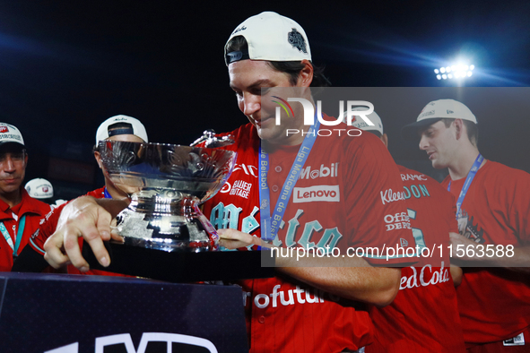 Trevor Bauer #96 of Diablos Rojos lifts the Zaachila Cup after winning the 2024 Mexican Baseball League (LMB) King Series Championship at Es...