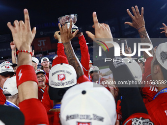 Diablos Rojos teammates celebrate after winning the 2024 Mexican Baseball League (LMB) King Series Championship at Estadio Mobil Super. Diab...