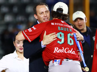 Trevor Bauer #96 of Diablos Rojos receives a gold medal from the president of LMB, Horacio de la Vega, after winning the 2024 Mexican Baseba...