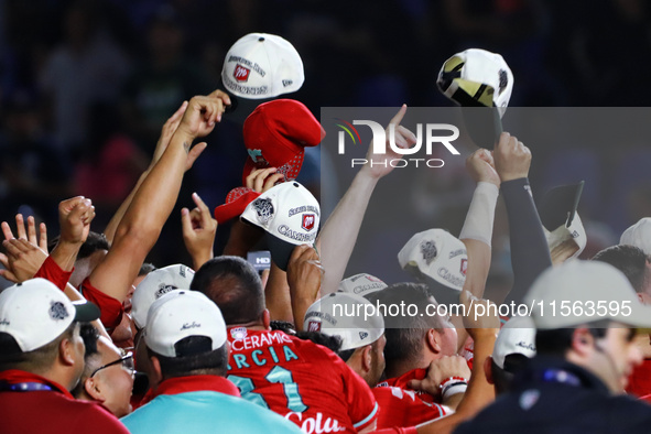 Diablos Rojos teammates celebrate after winning the 2024 Mexican Baseball League (LMB) King Series Championship at Estadio Mobil Super. Diab...