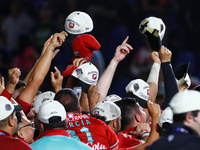 Diablos Rojos teammates celebrate after winning the 2024 Mexican Baseball League (LMB) King Series Championship at Estadio Mobil Super. Diab...