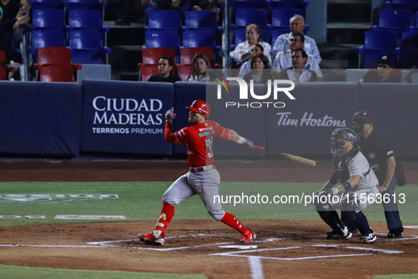 Jose Marmolejos #46 of Diablos Rojos hits the ball during the 2024 Mexican Baseball League (LMB) King Series Championship match between Diab...