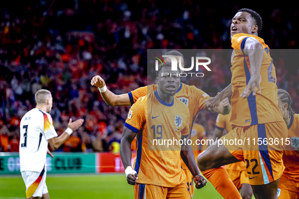 Netherlands forward Brian Brobbey and Netherlands defender Denzel Dumfries celebrate the goal during the match between the Netherlands and G...